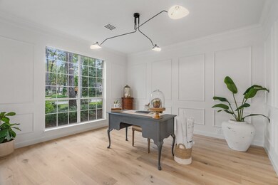 Study in the front of the home with picture frame molding, new lighting and fresh paint!