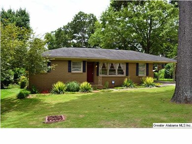 Low-maintenance brick home with lots of hardwoods,