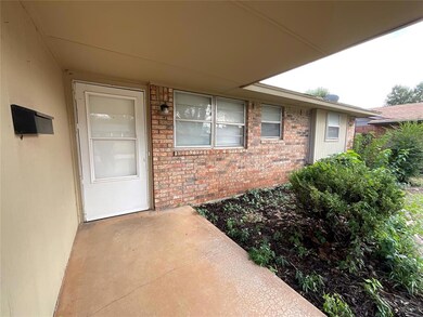 Doorway to property featuring a patio