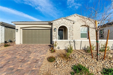 View of front facade featuring stucco siding, deco