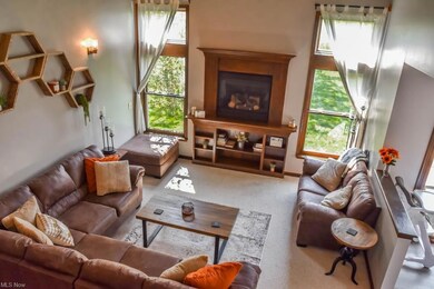 2-story great room with a fireplace.