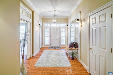 Light filled foyer with mirrored wall.