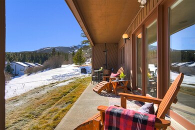 There is a covered patio with a privacy wall, grea