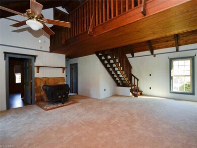 New carpet in living room and dining room combo. Cozy up next to the fireplace.