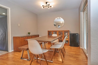 This dining room features beautiful flooring and c