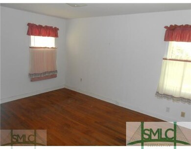 Bedroom. 3rd Bedroom with beautiful wood flooring.