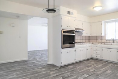 Eating area and kitchen looking into Living room