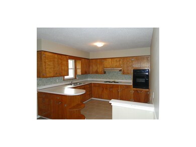 Loads of cabinets & tiled kitchen floor