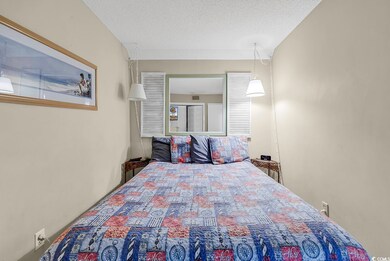 Bedroom with a textured ceiling