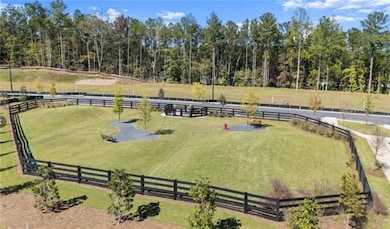 Surrounding community featuring an enclosed riding area