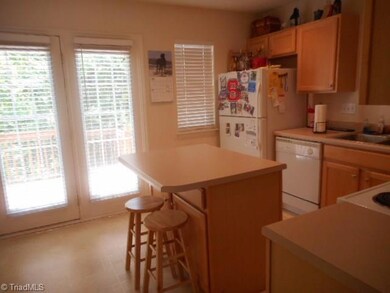 Open kitchen with center island and plenty of counter space. Light and airy!