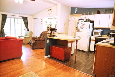 Kitchen has a counter that can also be used for a 