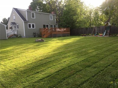 View of back yard and deck