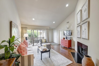 Spacious living room features a wood burning firep