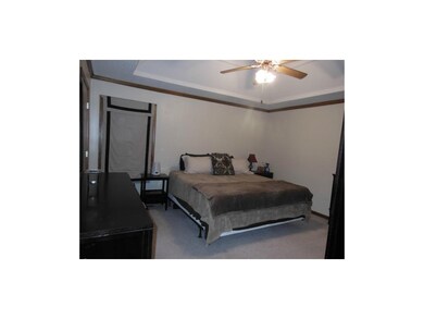 Master bedroom has vaulted ceiling and walk-in clo