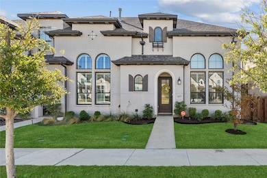View of front facade with brick siding and roof with shingles