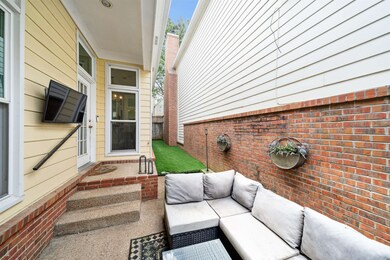 View of patio with an outdoor hangout area