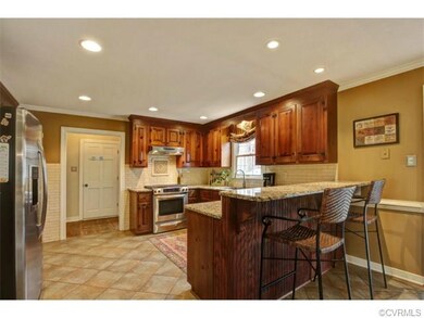 Updated kitchen with stainless appliances, granite