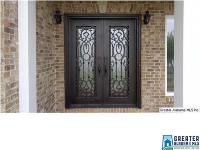 Grand entry with double iron doors