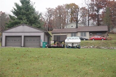 Front view of home and detached garage