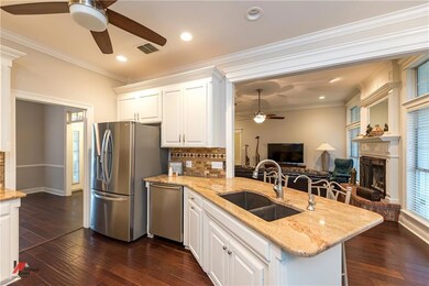 Hardwood flooring throughout living, dining, and k