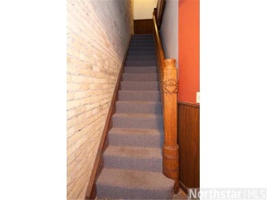 Character of an original staircase and exposed bri