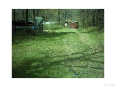 Exterior Front. Looking down driveway