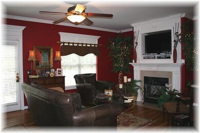 Cozy gas fireplace, hardwood & extensive wood trim.