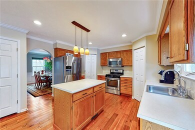 The large kitchen offers an island and two pantrie