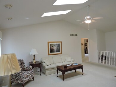 Vaulted Great Room with open stairway to finished 