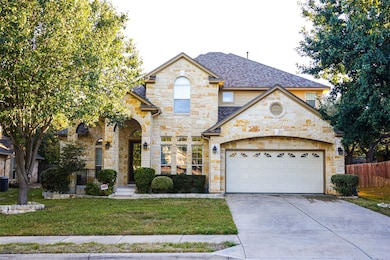 French country style house featuring roof with shingles, concrete driveway, stone siding, and a garage
