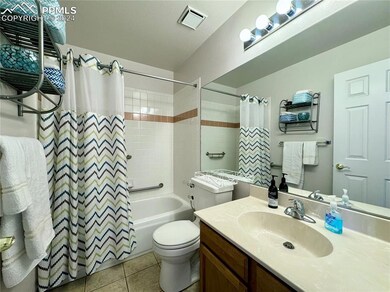 Full bathroom with vanity, shower / bath combo, an