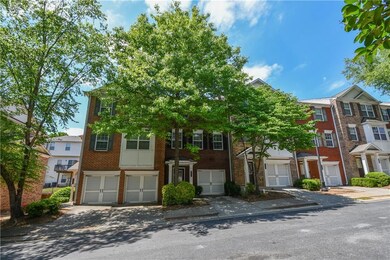 Townhome / multi-family property featuring brick s