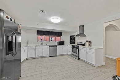 Kitchen featuring light countertops, visible vents