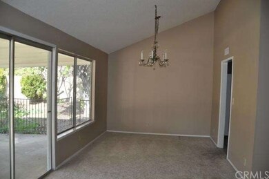 living room leading out to covered patio area