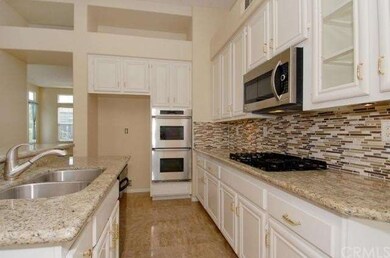 New Granite, Backsplash, Sinks and Travertine Floo