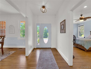 Foyer with hardwood / wood-style flooring and ceil