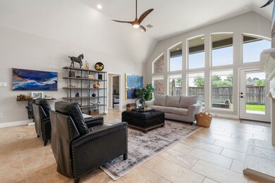 This stunning living area showcases soaring vaulte