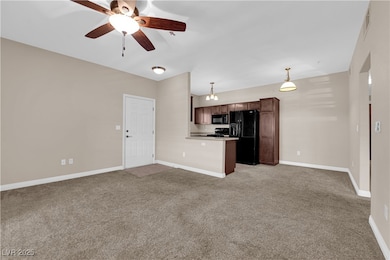 Unfurnished living room with light carpet and ceil