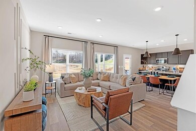 Living area with light wood finished floors, visib