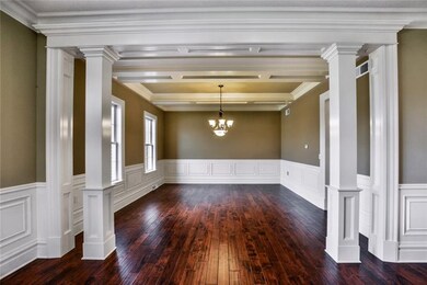 SPACIOUS DINING ROOM WITH TRIM WORK GALORE