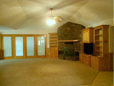 Living Room. 23 x 20 Living room with custom built storage and entertainment,