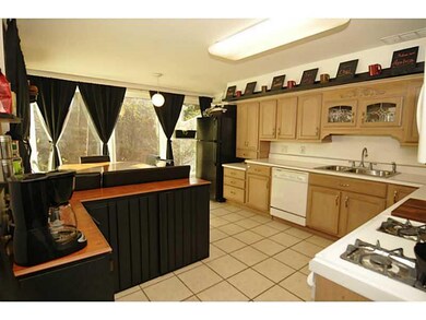 Kitchen. There are two walls of windows and plenty