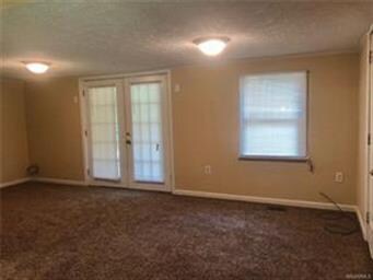 Living room with French doors out to the deck!