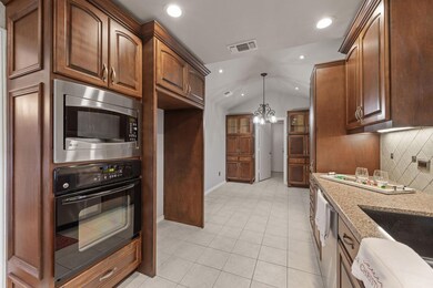 Kitchen boast gorgeous built in cabinets with all 