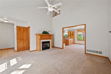 The living room includes a gas fireplace and opens