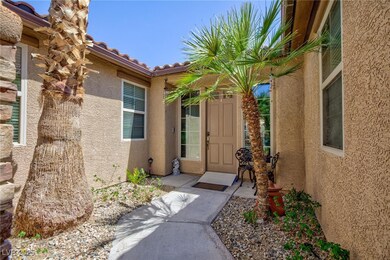 Property entrance with stucco siding and a tiled roof