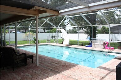 Screened in pool with paver decking