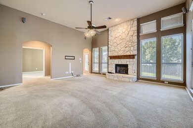 Unfurnished living room with light carpet, a high 