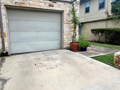 Garage featuring driveway